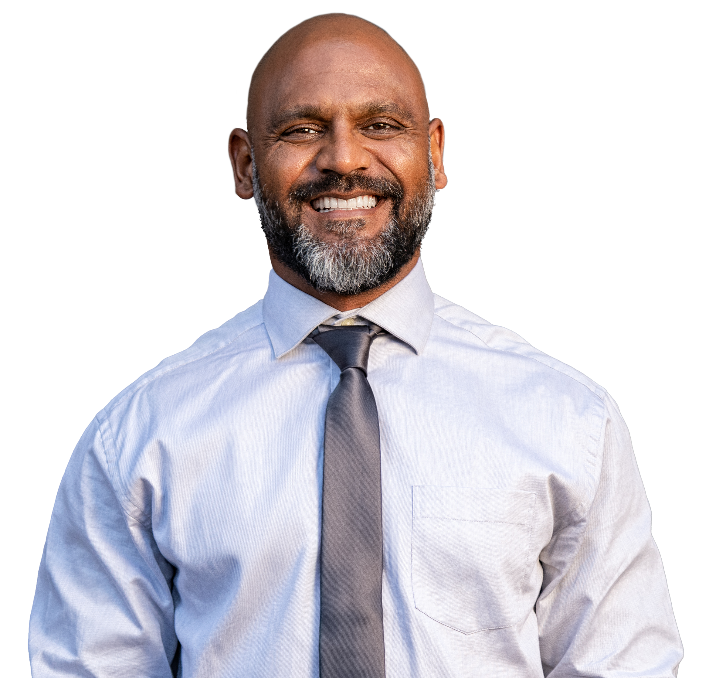 Professional man in a button down shirt with tie smiling
