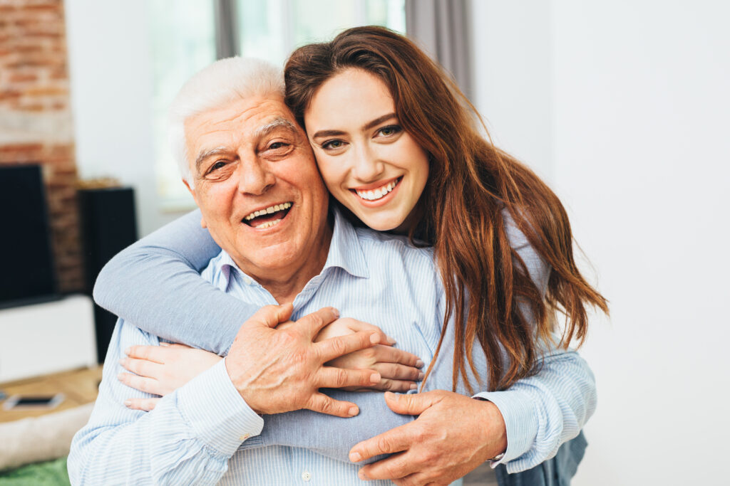 Beautiful woman with her father as they both smile