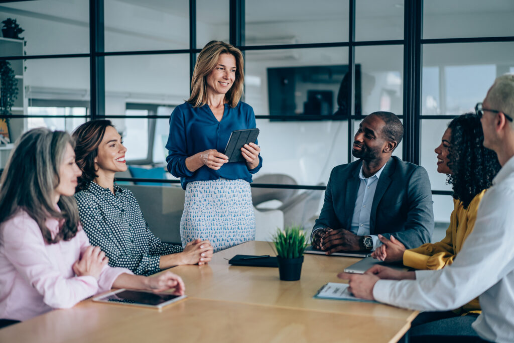 A small group of people at a table in a business meeting