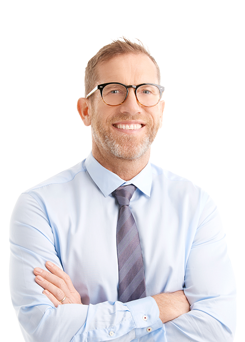 A smiling business professional in a shirt and tie and arms crossed